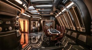 USS Sarek's Observation Lounge with viewports, LCARS panel, and conference table with chairs (image credit: Dave Blass)